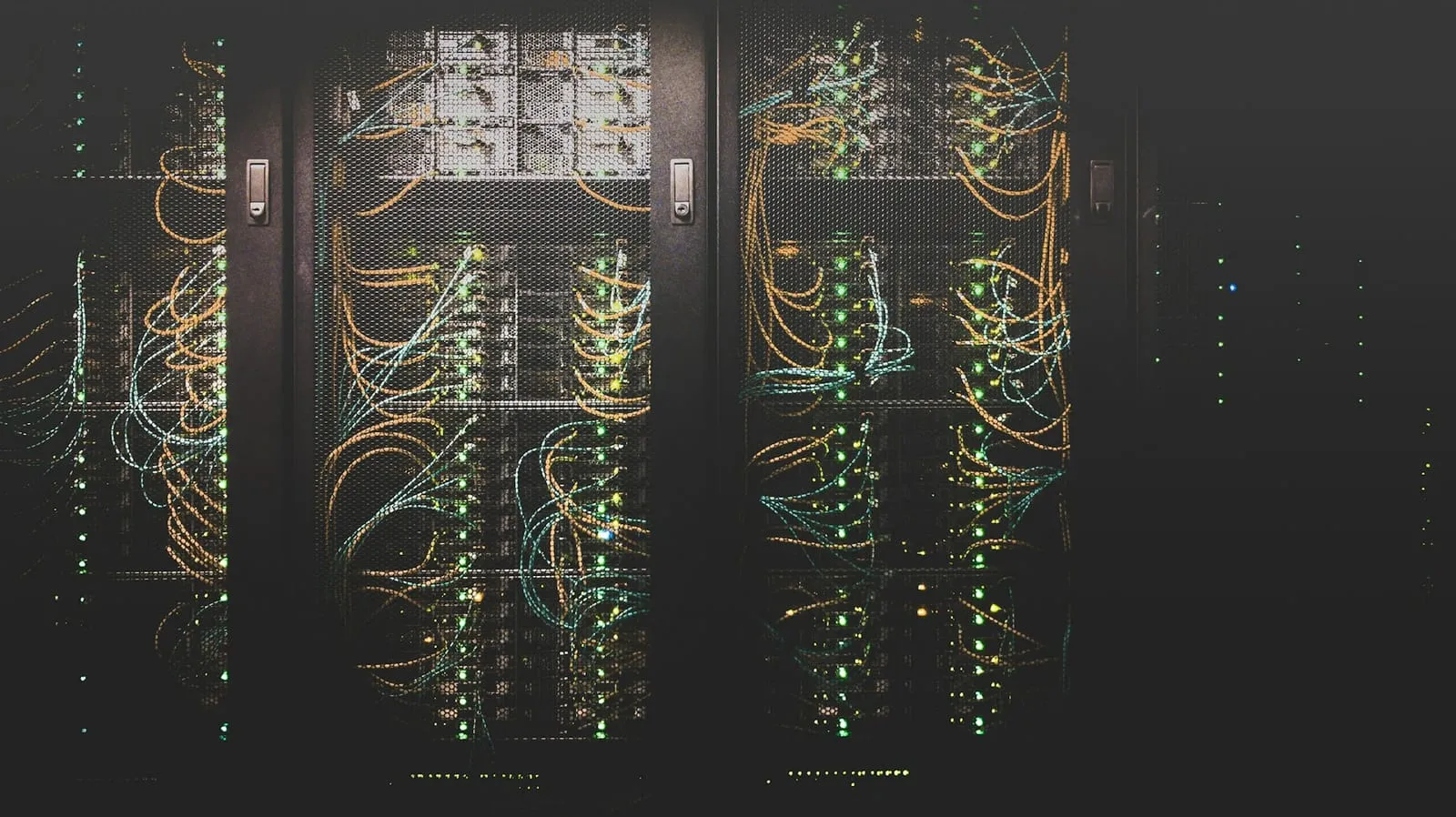 Rows of servers and network cabling in a data centre.